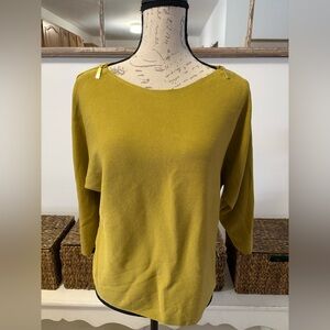 Chico’s top featuring gold zippered sleeves, very stylish.